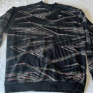 Gymshark green and pink crew neck. Size small but definitely fits oversized.